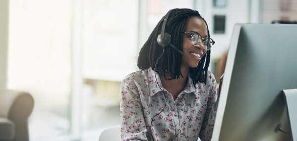 Smiling woman using contact center software