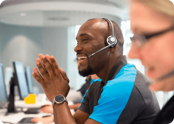 Man smiling wearing headset - Centrica customer success automation story
