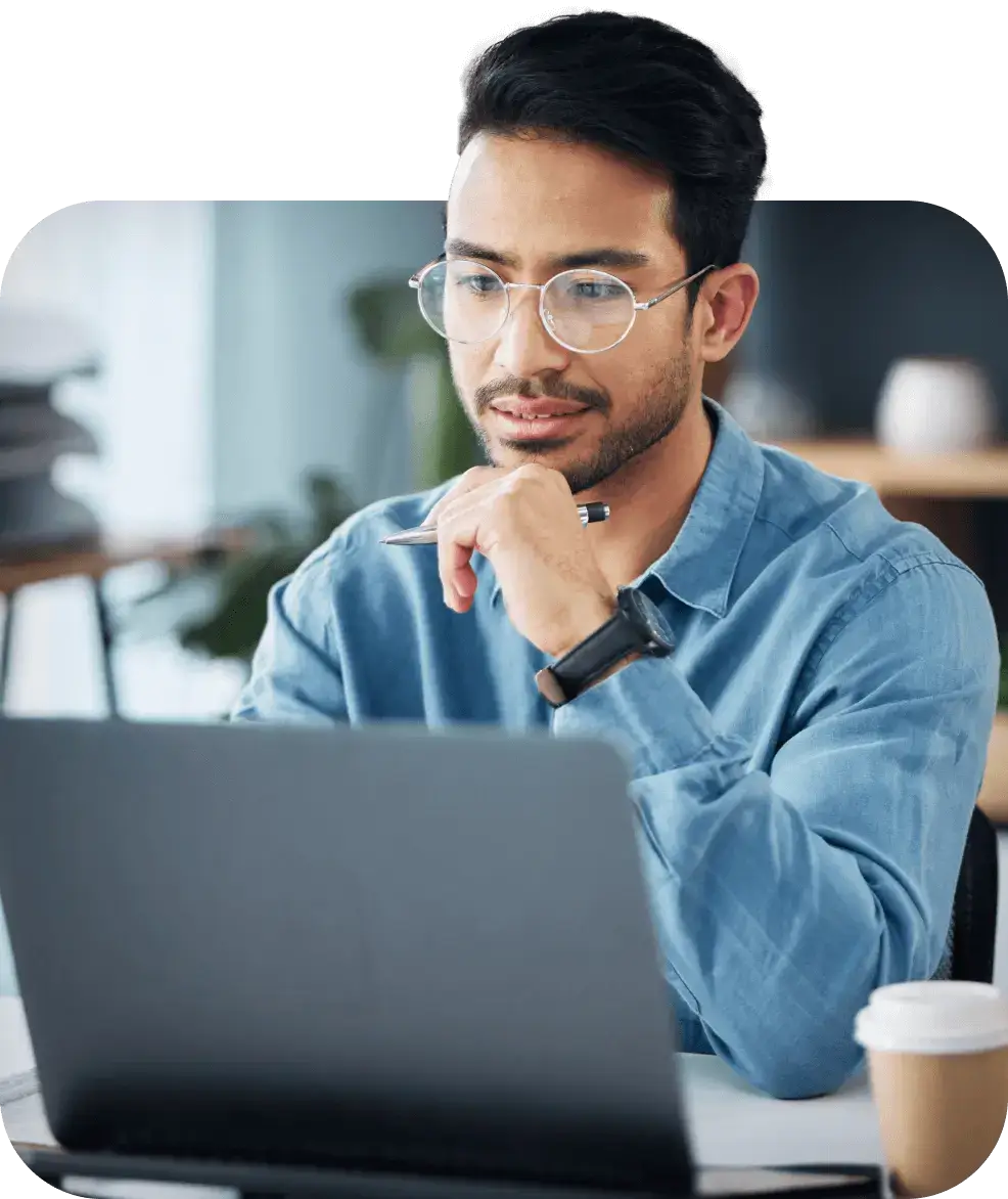 automated workforce management male looking at laptop computer